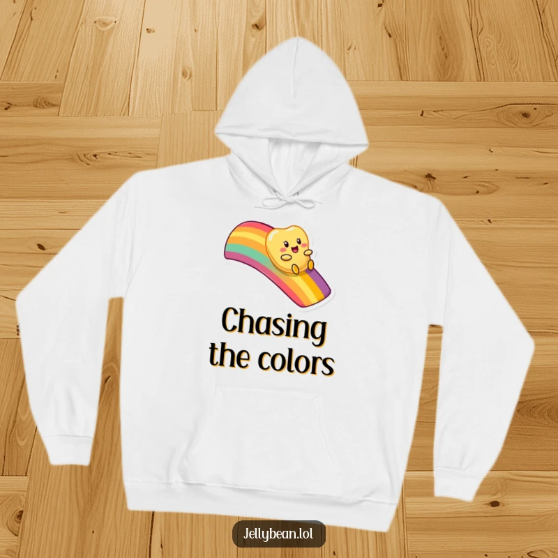 Funny hoodie with an anthropomorphic jelly bean character enjoying a playful slide down a spectacular, colorful rainbow.