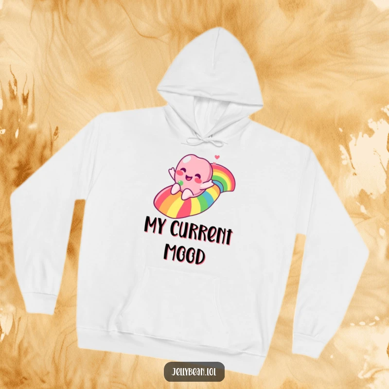 A comfy hoodie featuring a funny jelly bean character sliding down a bright rainbow, radiating happiness and warmth.
