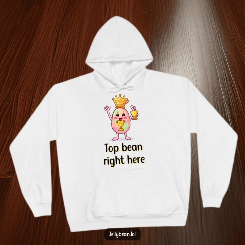 Funny hoodie: A jelly bean character joyfully holds a large trophy, exuding confidence and sugary success.