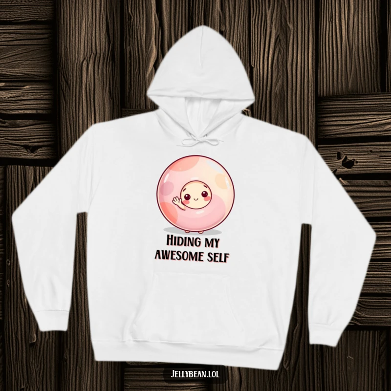 Funny hoodie featuring a shy jelly bean character peeking from behind a large gumdrop, offering a small, sweet wave in a cozy embrace.