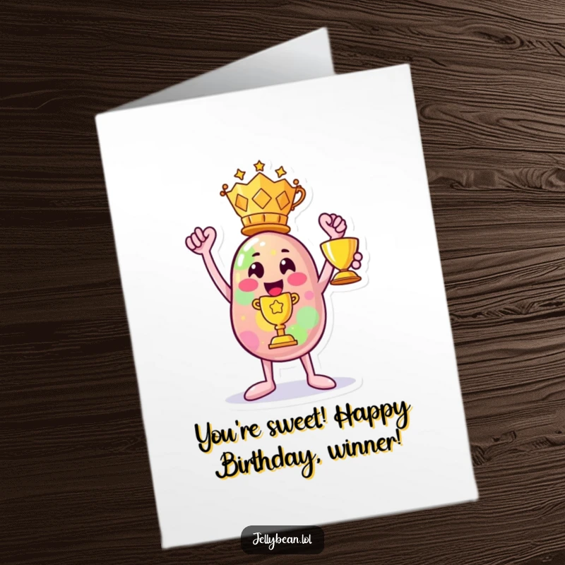 Funny Free Printable Birthday Card: Anthropomorphic jelly bean character triumphantly holding a trophy, celebrating a win.