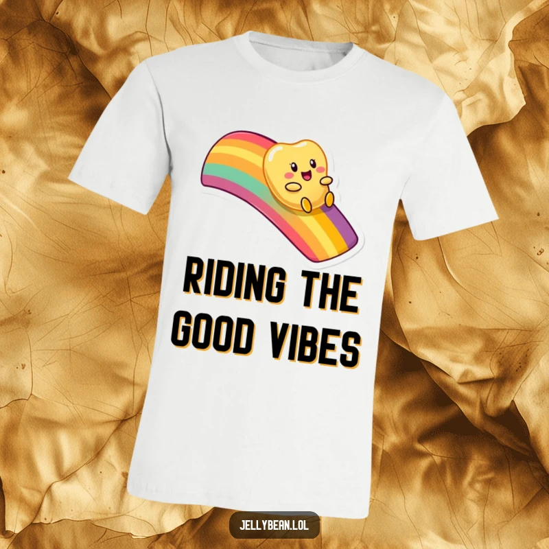Funny t-shirt depicting an anthropomorphic jelly bean character having fun sliding down a bright, multi-colored rainbow.